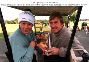 Kenny Dalglish shows a copy of his autobiography Dalglish My Autobiography to Gordon Kenny Dalglish shows a copy of his autobiography Dalglish My Autobiography to Gordon