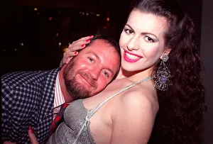 Kenny Everett rests on cleavage of Cleo Rocos 1988 Kenny Everett rests on cleavage of Cleo Rocos 1988
