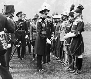 King George VI seen here presenting Coronation medals to members of the Oversea King George VI seen here presenting Coronation medals to members of the Oversea