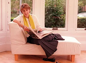 Images Dated 7th October 1999: Kirsty Wark October 1999 TV Presenter reading a book on a sofa in her home