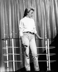 Kylie Minogue Singer Actress wearing jeans and pullover holding microphone Kylie Minogue Singer Actress wearing jeans and pullover holding microphone