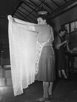 A lace shawl seen here undergoing quality control at The Shawl Factory of GH Hurt A lace shawl seen here undergoing quality control at The Shawl Factory of GH Hurt