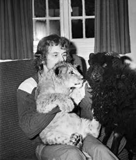 Lamb and Lion and Safari Warden Ken Lawrence. December 1974 74-7586 Lamb and Lion and Safari Warden Ken Lawrence. December 1974 74-7586