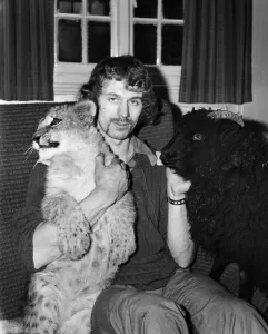 Lamb and Lion and Safari Warden Ken Lawrence. December 1974 74-7586-005 Lamb and Lion and Safari Warden Ken Lawrence. December 1974 74-7586-005