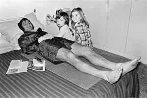 00244 Gallery: Larry Lloyd Coventry City football player lying on bed at home as he recuperates