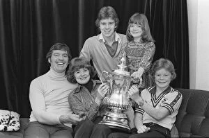Laurie McMenemy with his wife and children holding the FA Cup at their home 14 / 2 / 77