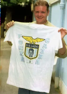 Lazio footballer Paul Gascoigne holds a club t shirt after a training session 26th Lazio footballer Paul Gascoigne holds a club t shirt after a training session 26th