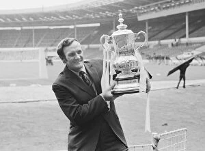 Leeds Manager Don Revie seen here in a deserted Wembley holding the F.A