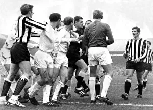 Leeds player Jack Charlton in the middle of this sskirmish in a game against Newcastle Leeds player Jack Charlton in the middle of this sskirmish in a game against Newcastle