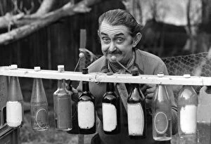 Images Dated 19th March 1978: Len Austin and his boozaphone, a musical instrument made from old beer and wine bottles