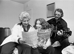 Musicals Gallery: Lena Zavaroni, aged 14, enjoys a singalong with parents Hilda and Victor