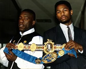 Images Dated 4th March 1991: Lennox Lewis Boxer with Gary Mason showing off their belts before their heavy weight