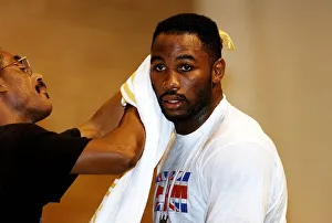 Images Dated 24th September 1993: Lennox Lewis Boxing Heavyweight Boxer takes a break during a training session for his
