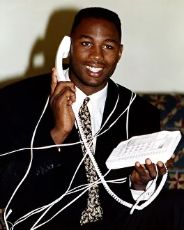 Lennox Lewis Boxing Heavyweight Boxer tied up with telepohone cord while talking Lennox Lewis Boxing Heavyweight Boxer tied up with telepohone cord while talking