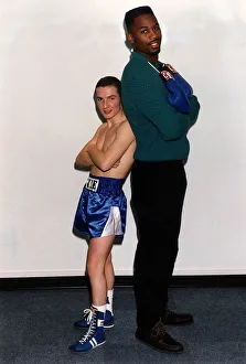 Images Dated 11th December 1991: Lennox Lewis Heavyweight Boxer stands well over Mickey Cantwell