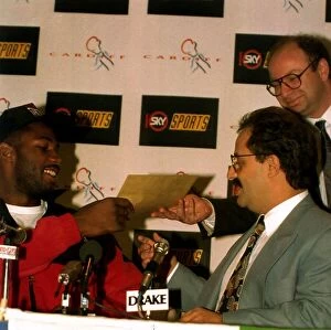 Images Dated 29th September 1993: Lennox Lewis former World Heavyweight Boxing Champion being handed a writ by Frank