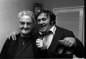 Les Dawson comedian 1974 arm round old woman holding shoes tie undone Les Dawson comedian 1974 arm round old woman holding shoes tie undone