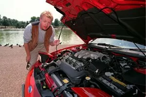 Images Dated 11th December 1997: Les Dennis Comedian / TV Presenter December 97 Looking in to the engine of the new