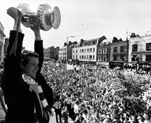 Liam Brady of Arsenal holding up trophy for crowds in Highbury, North London Liam Brady of Arsenal holding up trophy for crowds in Highbury, North London