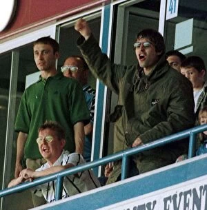 Images Dated 9th August 1997: Liam Gallagher pop singer cheers on Manchester City August 1997 English First Division