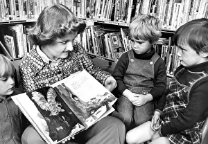 Library Assistant Christine Maley telling a story to Karen Miller Library Assistant Christine Maley telling a story to Karen Miller