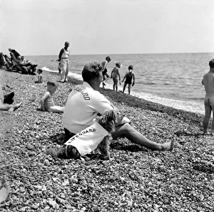 Lifeguard George Wheeler and his dog - Brighton Life - Saver. July 1952 C3455 Lifeguard George Wheeler and his dog - Brighton Life - Saver. July 1952 C3455