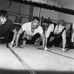 Light heavyweight boxer John Conteh (centre) and heavy weight boxer Joe Bugner (right Light heavyweight boxer John Conteh (centre) and heavy weight boxer Joe Bugner (right
