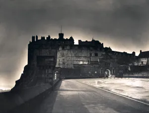 The light from Princes Street forms a halo around Edinburgh Castle as dusk falls The light from Princes Street forms a halo around Edinburgh Castle as dusk falls
