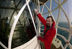 Images Dated 19th December 1992: Lighthouse keeper Colin Jones seen here clearing the light during this last relief tour