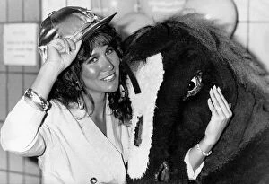 Occupation M Gallery: Linda Lusardi model actress standing with pantomime horse