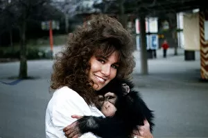 Images Dated 31st January 1990: Linda Lusardi Model / TV Presenter holding baby monkey January 1990 A©mirrorpix