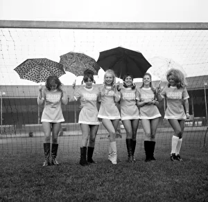 Lined up in their mini soccer dresses at what should have been the time for kick-off are Lined up in their mini soccer dresses at what should have been the time for kick-off are