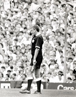 Images Dated 23rd August 1986: Linesman signals Referee after bottle thrown at him during the Arsenal v Manchester