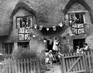 Little evacuees hang out bunting and flags in a Warwickshire village as they hold a Little evacuees hang out bunting and flags in a Warwickshire village as they hold a
