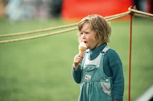 Images Dated 1st August 1993: A little girl enjoys an ice-cream at Kirkleatham Country Fayre. 1st August 1993