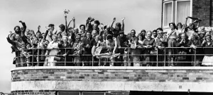 Supporters And Spectators Gallery: Liverpool fans gathered on the balcony at Speke Airport as their idols board their plane