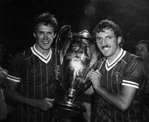Images Dated 30th May 1984: Liverpool FC players Phil Neal and Alan Kennedy with the European Cup