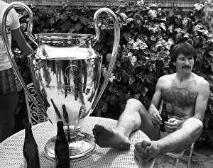 Liverpool footballer Tonny Smith enjoys a bottle of beer as he sits with the famous Liverpool footballer Tonny Smith enjoys a bottle of beer as he sits with the famous