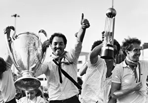 Liverpool goalkeeper Bruce Grobbelaar holds aloft the European Cup trophy as Granme Liverpool goalkeeper Bruce Grobbelaar holds aloft the European Cup trophy as Granme