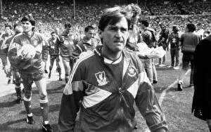 Liverpool manager Kenny Dalglish leads out his team at Wembley before the start of