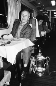 Liverpool manager Bill Shankly with the FA Cup trophy on board the train back to Liverpool manager Bill Shankly with the FA Cup trophy on board the train back to