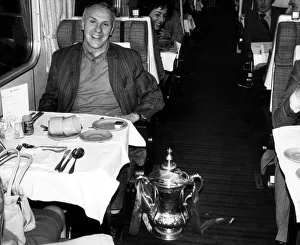 Liverpool manager Bill Shankly sitting at his table on the train home to Liverpool with Liverpool manager Bill Shankly sitting at his table on the train home to Liverpool with