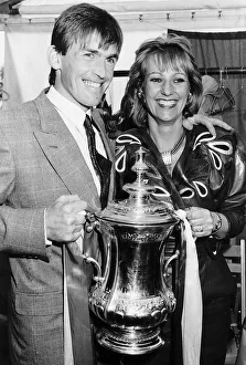 Liverpool player manager Kenny Dalglish holding the FA Cup trophy with his wife Marina Liverpool player manager Kenny Dalglish holding the FA Cup trophy with his wife Marina