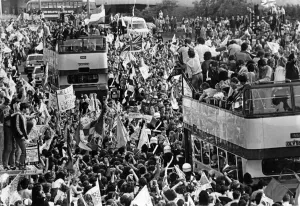 Liverpool players proudly show off the European Cup trophy to thousands of fans who lined Liverpool players proudly show off the European Cup trophy to thousands of fans who lined