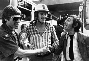 Supporters And Spectators Gallery: Liverpool players Steve Heighway and Ray Clemence share a joke with a fan outside
