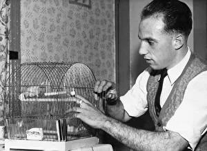 Liverpool full back Ronnie Moran with Joey, his pet canary at home.26th October 1955 Liverpool full back Ronnie Moran with Joey, his pet canary at home.26th October 1955