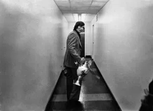 Liverpool v. Leicester Still Clutching the Trophy leaving the dressing room is Captain Liverpool v. Leicester Still Clutching the Trophy leaving the dressing room is Captain