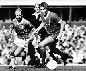 Images Dated 6th September 1980: Liverpools Kenny Dalglish shadowed by fellow Scot Archie Gemmill during their