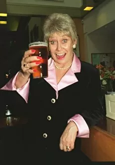 Images Dated 27th October 1995: Liz Dawn Vera Duckworth of Coronation Street raises a glass to celebrate her taking over