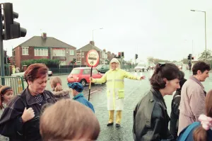 Images Dated 9th November 1995: Lollipop lady Janet Taylor on duty at the junction of Trunk Road with Kings Road